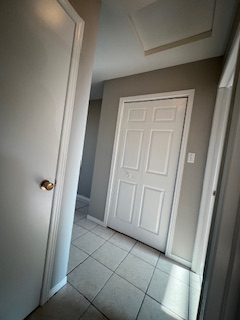 White six-panel doors and trim against grey walls