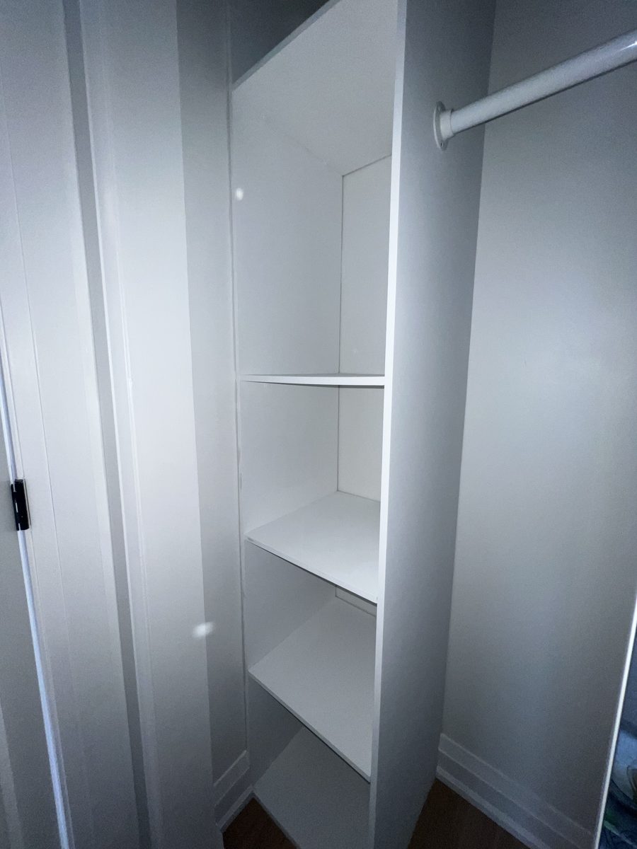 Empty painted white closet interior