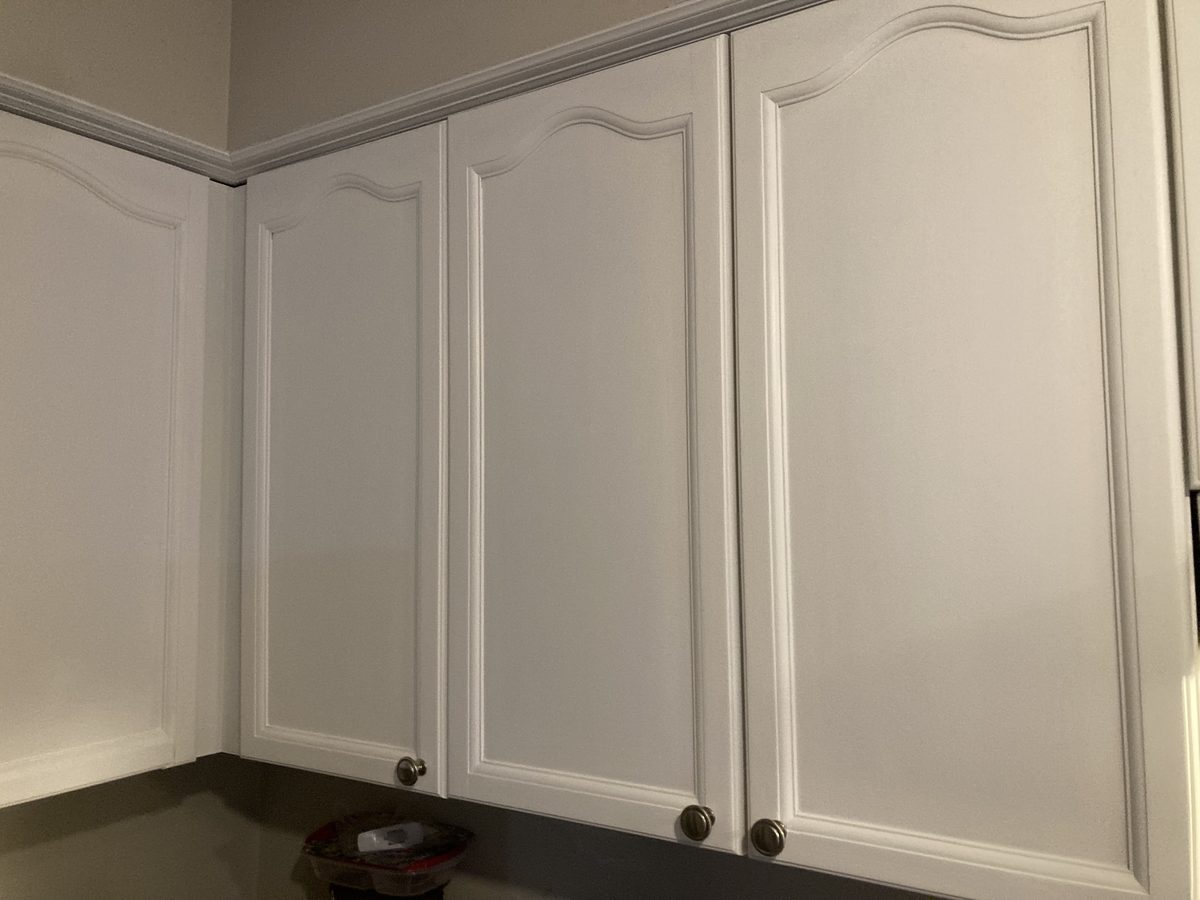 Painted white corner upper cabinets