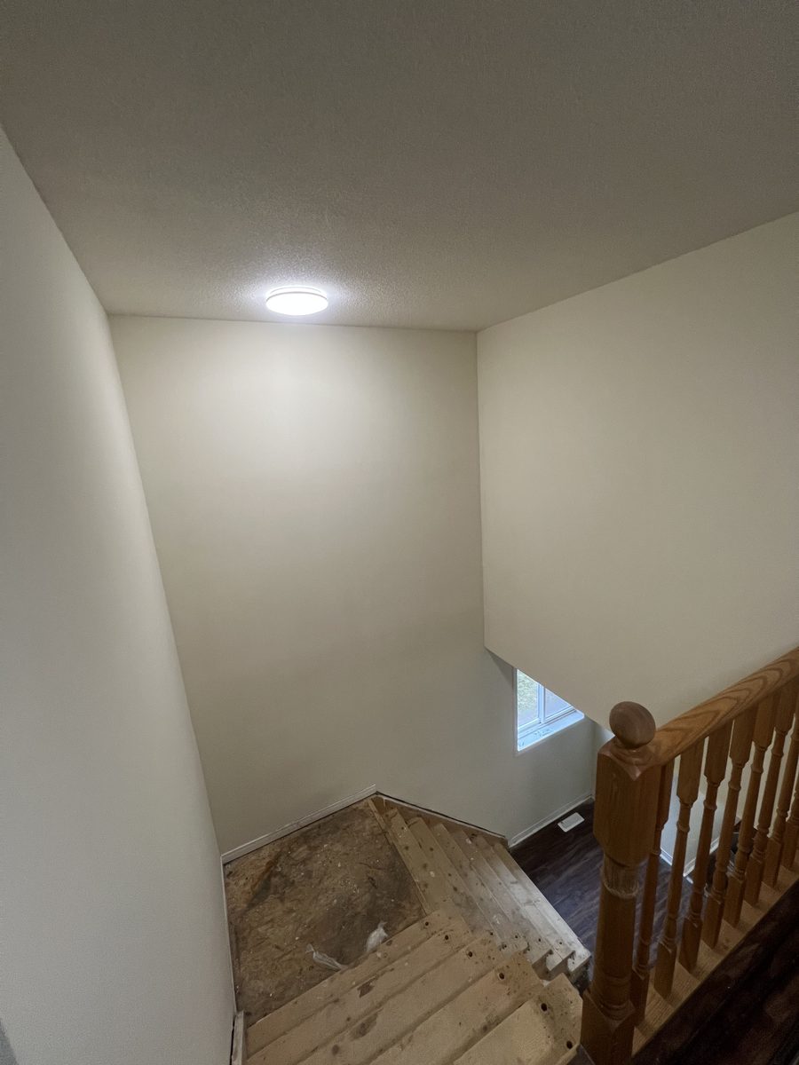 The stairwell ceiling and railing from the landing